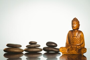 Buddha statue with stacked stones