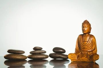 Wall murals Buddha statue with stacked stones