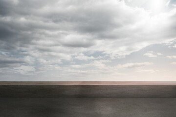 Empty paved surface is stretching toward horizon in flat design, featuring overcast sky, copy space