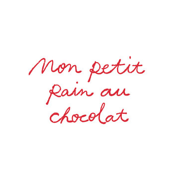 Handwritten french quote &ndash; mon petit pain au chocolat. a little french love note in red cursive