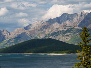 Mountain range and calm lake in Peter Lougheed Provincial Park, Alberta. Dramatic rock formations...