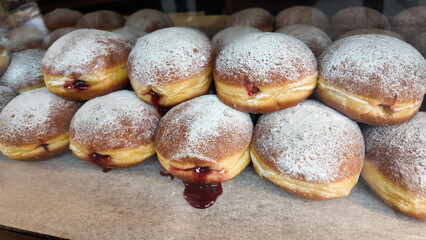 Delicious jelly-filled pastries displayed in a bakery