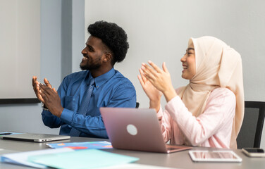 Diverse business team collaborating in modern office, professional muslim woman in hijab and...