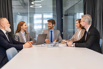 Professional executive businesspeople discuss corporation project planning sit at meeting room,...