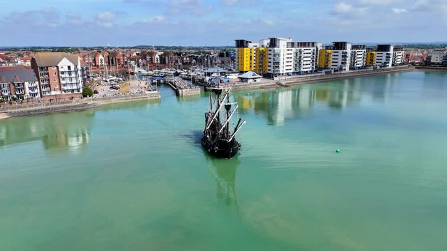 Aerial footage of the majestic Nao Victoria replica as it sails out of port, echoing the spirit of history&rsquo;s first global circumnavigation.