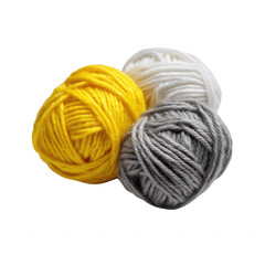 Three colorful balls of yarn, featuring vibrant yellow, soft white, and gentle gray shades, arranged artistically for crafting and knitting enthusiasts.