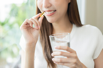 Dietary supplement, asian young woman, girl hand holding fish oil pills, drugs medical, take or eat...