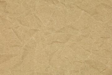 Crumpled brown paper texture, perfect for rustic backgrounds or design elements. Features a...