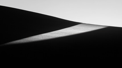 Stark Monochrome Dune: Light and Shadow on Textured Sandscape
