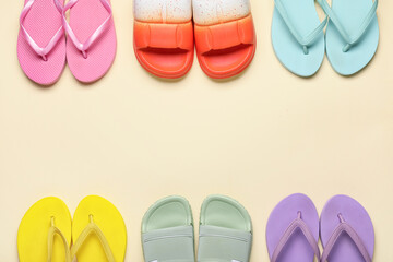 Frame made of different stylish flip-flops on beige background