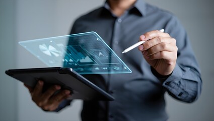 Businessman using stylus on futuristic holographic tablet interface displaying data analytics.