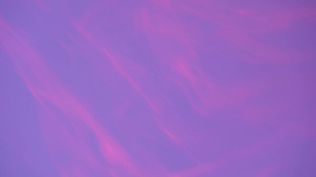 Gentle purple backdrop with slowly drifting pink motion streaks. Ideal for ambient and calming edits.