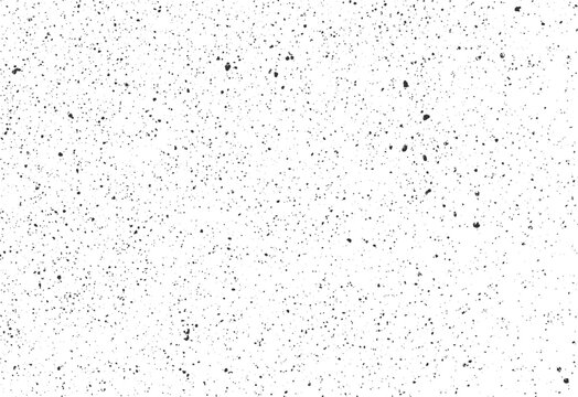 Fine speckled ink splatter texture with random grunge spots and soft scattered dust. High-resolution vector background for retro or print designs.