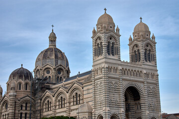 Domes and towers of the Marseille Cathedral of Sainte-Marie-Majeure in the La Joliette district, neo-Byzantine architecture under a blue sky