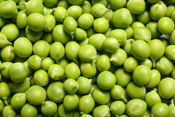Texture of fresh green peas as background