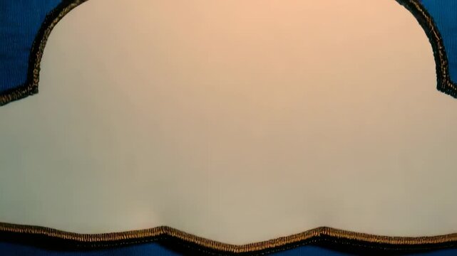 Embroidered cloud on blue fabric