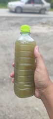 hand with bottle of water