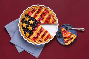 Tasty American flag pie on red grunge table. Independence Day celebration