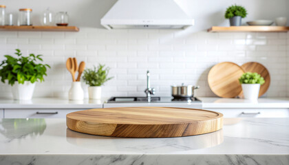 Close-up of a large empty plate placed on the countertop of a bright modern kitchen.