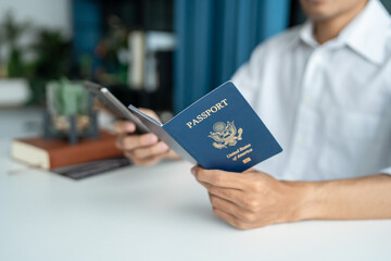 Hand Man Online booking and buying plane tickets using laptop phone and credit card Planning trip...