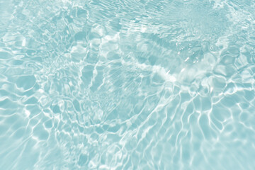Blue water with ripples on the surface. Defocus blurred transparent blue colored clear calm water...