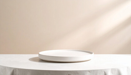 Close-up of an empty round ceramic plate placed on a table against a soft color background.