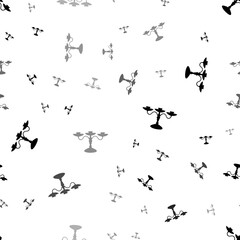 Seamless vector pattern with candlestick symbols, creating a creative monochrome background with rotated elements. Illustration on transparent background