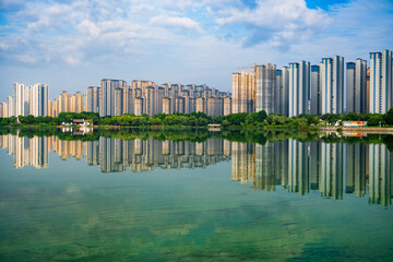 Landscape of modern high-rise buildings along the lake © jicheng