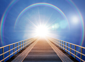 The road leading to heaven. The sun, the rainbow and the bridge to the sky. A good background on the topic of religion, faith, motivation, spiritual practice