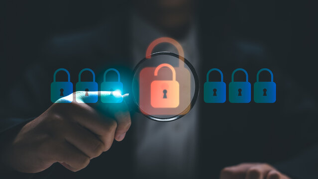 Cybersecurity concept showing a security analyst detecting a data breach. A businessman uses a magnifying glass to identify an unlocked padlock among secure digital locks.