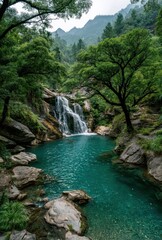 Fototapeta premium Serene Waterfall Surrounded by Lush Greenery in a Tranquil Natural Landscape with Clear Blue Pool and Majestic Mountains in Background