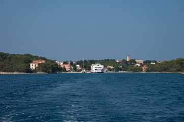 The ferry departing from a small Mediterranean town