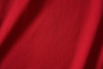 Close up of red football jersey sports clothing fabric texture.