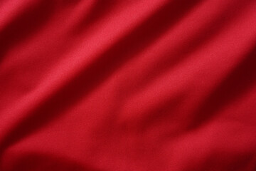 Close up of red football jersey sports clothing fabric texture.