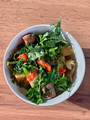 Dymlyama. Central Asian vegetable stew with meat, cabbage, tomatoes, sweet peppers, potatoes, carrots, garlic and onions