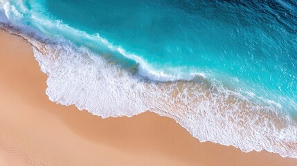 Clean turquoise wave with white foam line rolling toward a smooth, untouched beach
