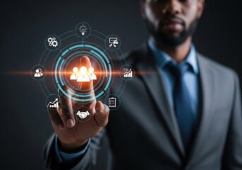 Businessman interacting with a futuristic digital interface displaying business icons and data