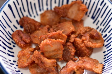 Deep fried crispy pork belly, Crispy Fried Pork Belly with Chili Sauce, Deep fried crispy pork belly sliced cooked with salt and Thai spicy dipping sauce