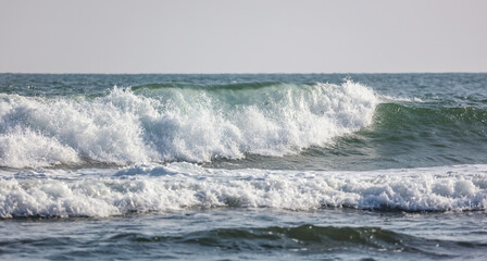 The ocean is calm and the waves are small