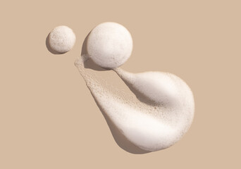 texture foam mousse foam cosmetic smear sample on beige background