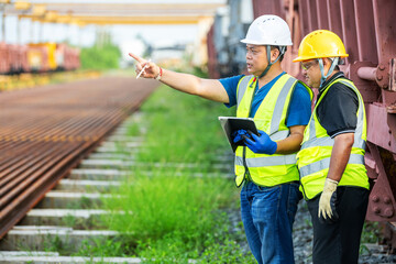 Locomotive Front Inspection by Engineer Teamwork Professional Team Railway Maintenance Two Technician Collaborating on Train Track Engine Train Coupling System, locomotive check by worker rail engine