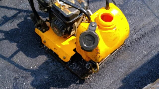 Cikancung, West Java, Indonesia. 2 July, 2025. Cinematic footage of asphalt paver. Tool to smooth the hot asphalt that has just been poured onto the road. Road repair industry. High Quality 4K 30 Fps
