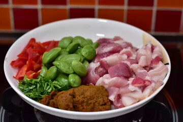 Spicy stir fried pork with Cluster Bean (Bitter Bean or stink beans) popular southern Thai food, Spicy stir fried chicken with Cluster Bean (Bitter Bean or stink beans).Thai southern food