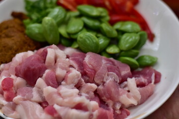 Spicy stir fried pork with Cluster Bean (Bitter Bean or stink beans) popular southern Thai food, Spicy stir fried chicken with Cluster Bean (Bitter Bean or stink beans).Thai southern food
