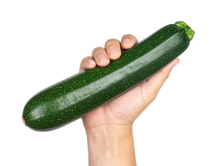 Chef holding a fresh zucchini isolated on transparent background, healthy eating and raw food concept