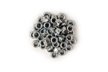A group of metal nuts isolated on a white background.