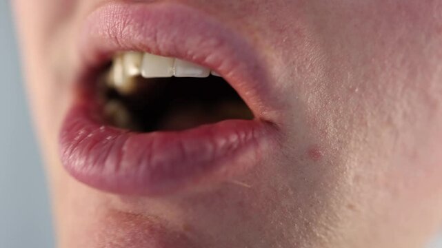 Chewing food with visible dental plaque and stained teeth in a disturbing closeup emphasizing poor oral hygiene and long-term consequences of unhealthy eating