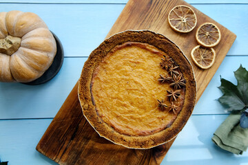 Pumpkin pie garnished with anise. Homemade traditional American thanksgiving pie, top view