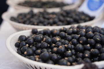 Berries on a large plate on the table. Summer harvest.