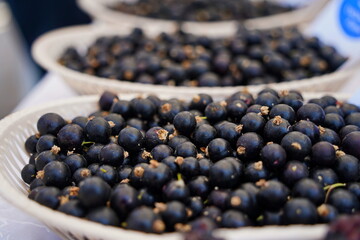 Berries on a large plate on the table. Summer harvest.